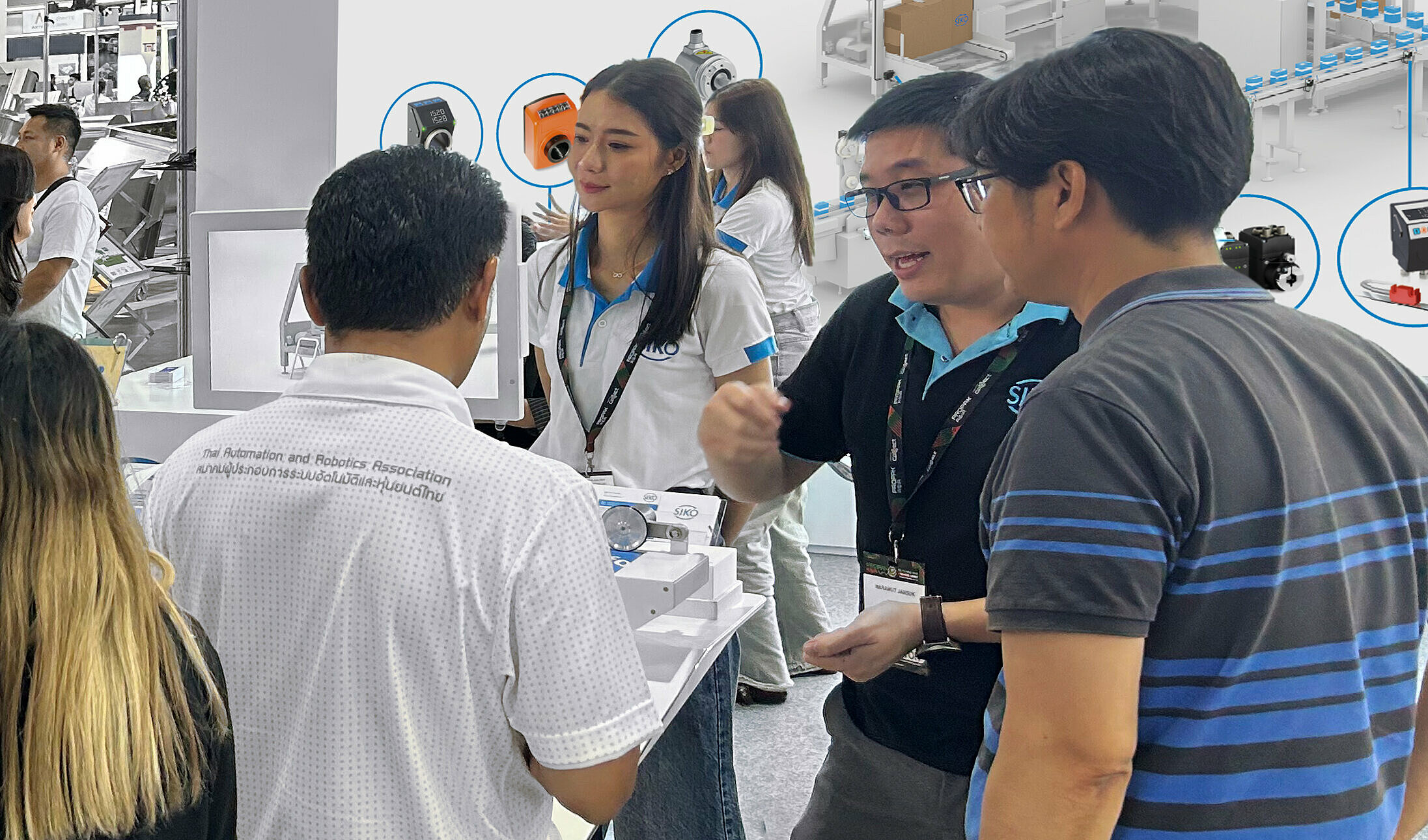 SIKO员工在亚洲某次展会上与客户交谈 SIKO员工在亚洲某次展会上与客户交谈