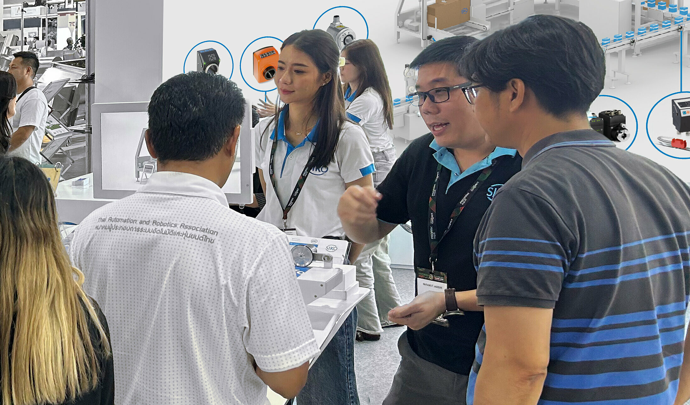 SIKO employees talking with customers at a trade show in Asia SIKO employees talking with customers at a trade show in Asia